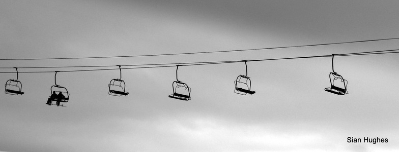 Snowboards on chairlift, Morzine