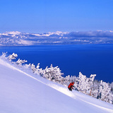 Skiing Heavenly with Lake Tahoe in the backdrop, USA - California