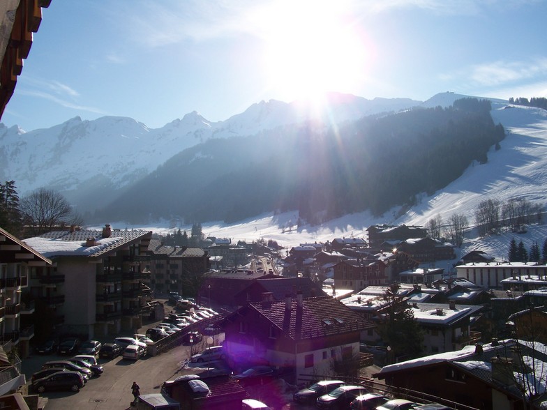 Beautiful sight over the village on the runs with sun, La Clusaz