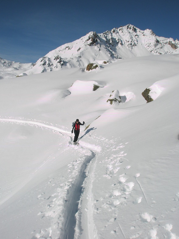 Caroline walking to the Shlippin pass into Austria from Madrisa above Klosters, Davos