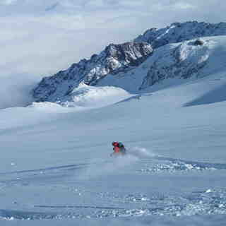 Kim heading into the abyss.  by J. Puchek, La Grave-La Meije