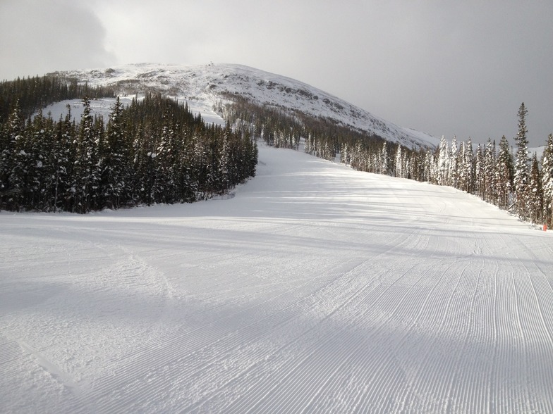 Mapmaker looking up to gold Chair, Nakiska