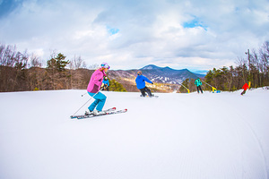 A group skiing and snowboarding at Massanutten Resort photo