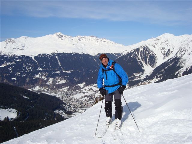 Tony on the Girafe with the Austian border and the Schlapin pass and Klosters in the background, Davos