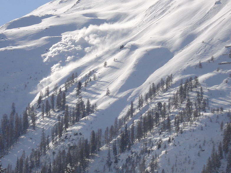 a powder avalanche on the northern face of Jakobshorn, Davos